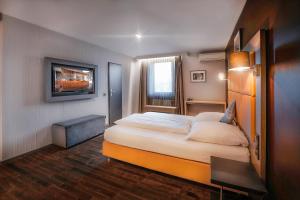 Cama ou camas em um quarto em Hotel Cult Frankfurt City