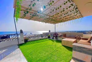 a living room with a view of the ocean at sea view house in Marsa Alam City