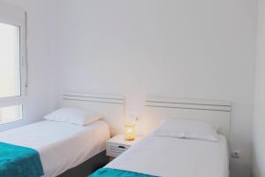 Łóżko lub łóżka w pokoju w obiekcie Luxury apartment puerto marina los alcazares