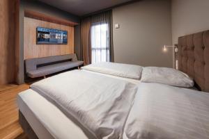 Cama ou camas em um quarto em Hotel Cult Frankfurt City