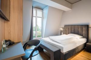 Cama ou camas em um quarto em Hotel Cult Frankfurt City