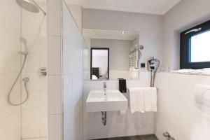 Um banheiro em Hotel Cult Frankfurt City
