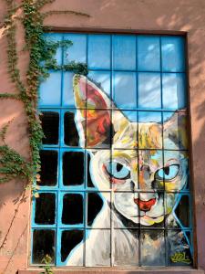 a painting of a cat on the side of a building at Guilin Changshe Hotel in Guilin