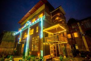 a building with blue lights on it at night at Guilin Changshe Hotel in Guilin