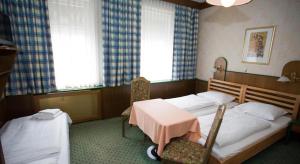 Postel nebo postele na pokoji v ubytování Hotel Hadrigan