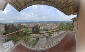 a balcony with a view of a city at Bella Vista in Canelli