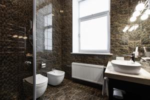 Koupelna v ubytování Tsunami Spa Hotel