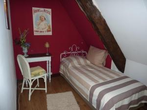 Ліжко або ліжка в номері Le Domaine de Loupiac