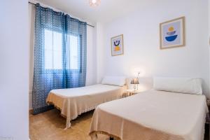 Postel nebo postele na pokoji v ubytování Apartamentos Madrid + 37 fotografií