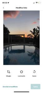 a screenshot of a website with a picture of a pool at Intero Dammuso Pantesco in Pantelleria