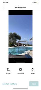 een screenshot van een website met een foto van een pool bij Intero Dammuso Pantesco in Pantelleria