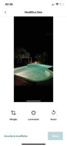 a picture of a swimming pool at night at Intero Dammuso Pantesco in Pantelleria