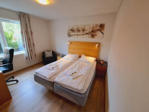 Ένα ή περισσότερα κρεβάτια σε δωμάτιο στο Tonstadli