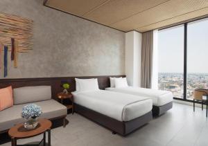 Ένα ή περισσότερα κρεβάτια σε δωμάτιο στο Ad Lib Hotel Khon Kaen