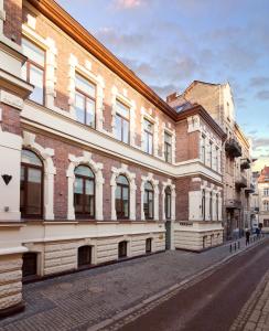 a building on the side of a street at FERENC Hotel & Restaurant in Lviv