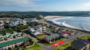 an aerial view of a small town next to the beach at Ocean Views, 50m from the beach! in East London