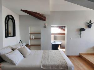 Postel nebo postele na pokoji v ubytování Chambres d'hôtes - Bed and Breakfast Les Palmiers