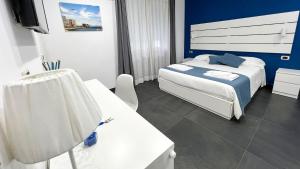Postel nebo postele na pokoji v ubytování Soave Rooms