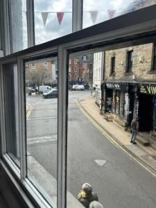 a view of a city street from a window at Market View 1 in Hexham