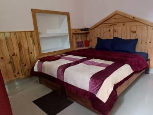 מיטה או מיטות בחדר ב-Hotel Kohinoor