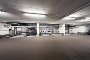 a parking garage with a car parked in it at Hotel Cult Frankfurt City in Frankfurt/Main