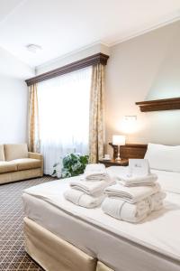 Postel nebo postele na pokoji v ubytování Hotel Crocus + 37 fotografií