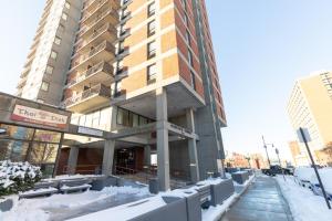 a building with snow in front of it at Allston 2br nr Boston U Green Line BOS-824 in Boston