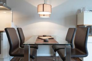 a dining room with a table and chairs at Villa Marin Wohnung 23 in Zinnowitz