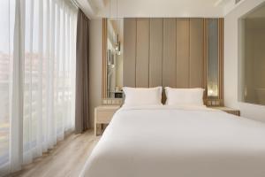 Katil atau katil-katil dalam bilik di Gamalan Star Hotel