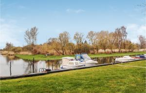 a group of boats are docked on a river at Gorgeous Apartment In Ribnitz-damgarten With Wifi in Ribnitz-Damgarten