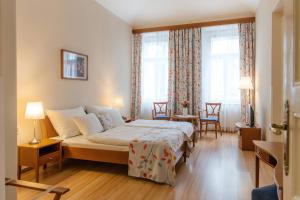 Postel nebo postele na pokoji v ubytování Hotel Orion