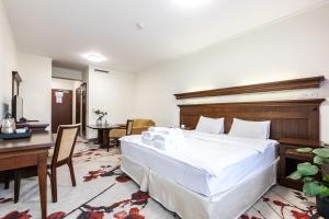 Postel nebo postele na pokoji v ubytování Hotel Crocus