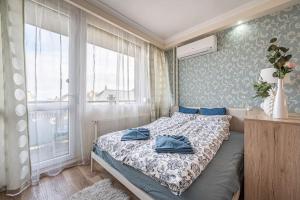 Posteľ alebo postele v izbe v ubytovaní Liszt Ferenc Square Panorama Apt