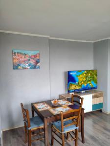 a dining room with a table and two chairs at Mladost 1 Apartment near the metro in Sofia