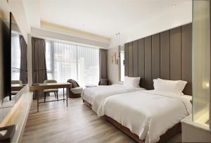 Katil atau katil-katil dalam bilik di Gamalan Star Hotel