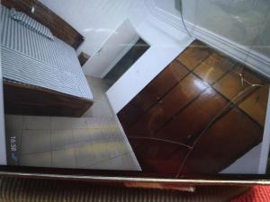 a view from the top of a room with wood floors at The furnished residences of Fasso Kanu -villa in Bamako