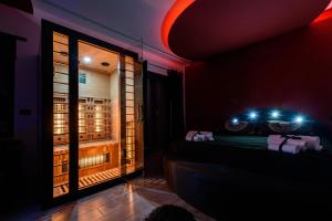 a room with a bed and a window with lights at B&B BELIEVE one room with spa in Naples