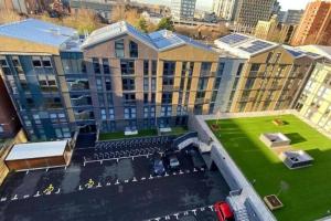 an aerial view of a building with a parking lot at Remarkable 2-Bed Apartment in Birmingham in Birmingham