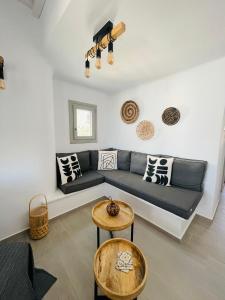 a living room with a couch and a table at Egea House in Stelida