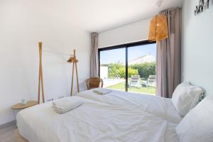 En eller flere senge i et værelse på Villa Front Loop + 25 billeder