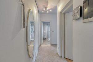 a hallway with a mirror and a bathroom at Apartment Burle with Balcony in Medulin
