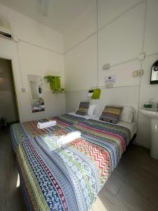 a bedroom with a bed and a sink in it at Youth Hostel - Central and Basic Universitat in Barcelona