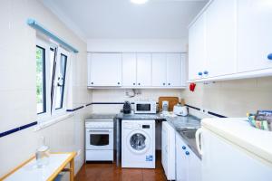 Kuchyň nebo kuchyňský kout v ubytování Cem Sentido - Alentejo Apartments