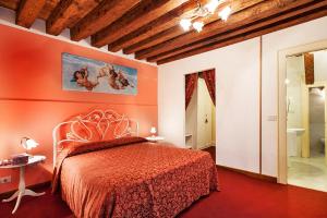 Postel nebo postele na pokoji v ubytování Maison San Marco