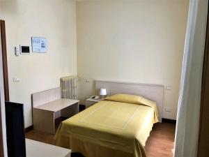 Postel nebo postele na pokoji v ubytování Hotel B&B Risorta
