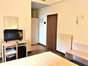 TV a/nebo společenská místnost v ubytování Hotel B&B Risorta