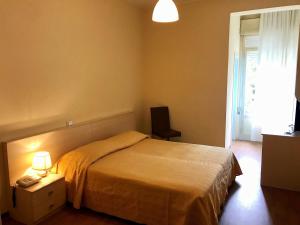 Postel nebo postele na pokoji v ubytování Hotel B&B Risorta