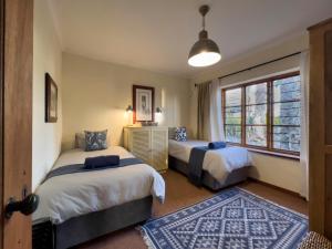 a bedroom with two beds and a window at Mira Mar 8 in Swakopmund