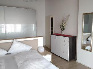 Voodi või voodid majutusasutuse Appartements am Kirchplatz toas