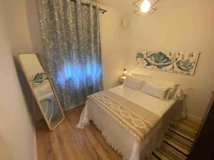Кровать или кровати в номере Precioso apartamento, exterior, soleado, air contr